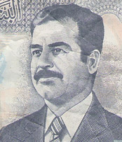 That's former Iraqi leader Saddam Hussein, on an old 100-dinar note.  (By the way, this is the only bill I didn't collect on a personal visit to the country; a friend gave me this as a souvenir of IRAQ.)